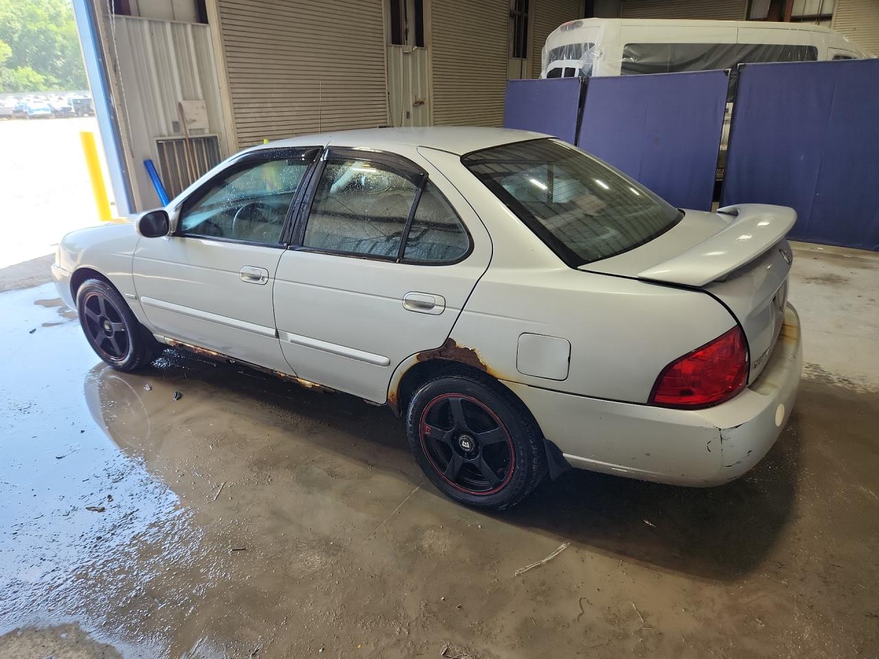 2006 Nissan Sentra 1.8 Silver vin: 3N1CB51D36L623293 Damage: Left Qtr Panel, Corrosion, > 12 Inches