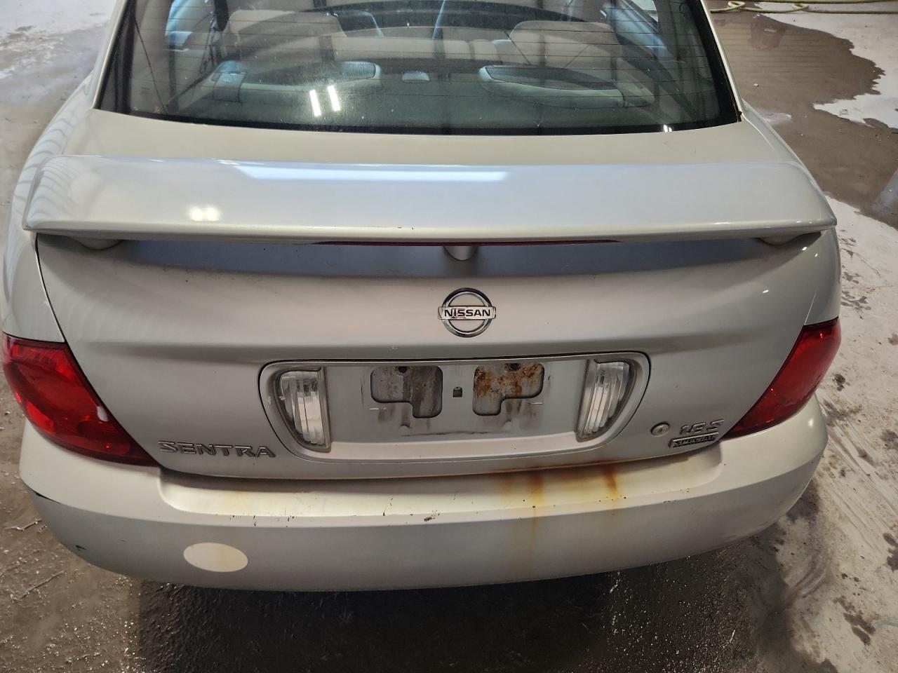 2006 Nissan Sentra 1.8 Silver vin: 3N1CB51D36L623293 Damage: Deck Lid, Corrosion, > 12 Inches