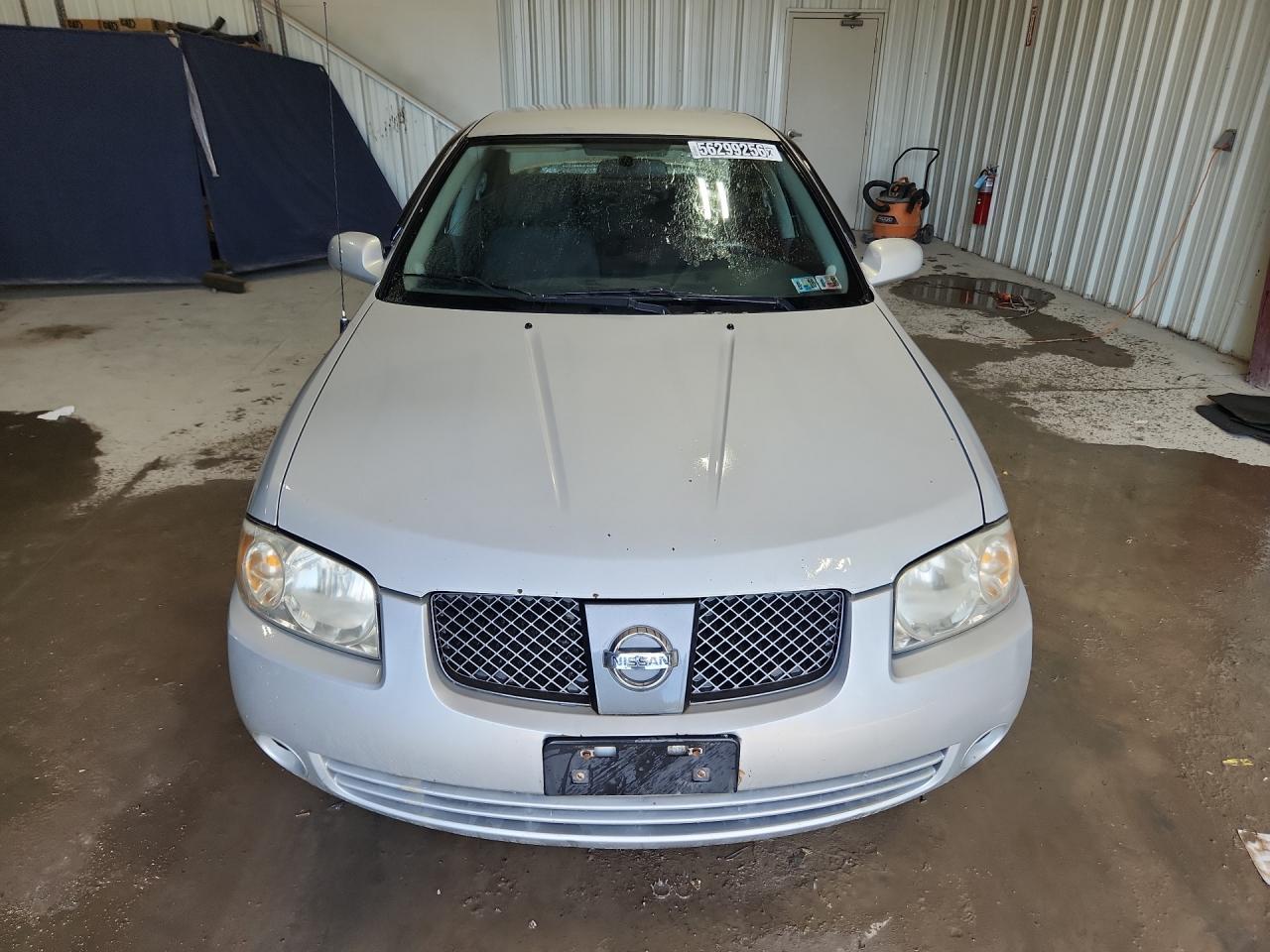 2006 Nissan Sentra 1.8 Silver vin: 3N1CB51D36L623293 Damage: Left Head Lamp, Faded, Repair Required