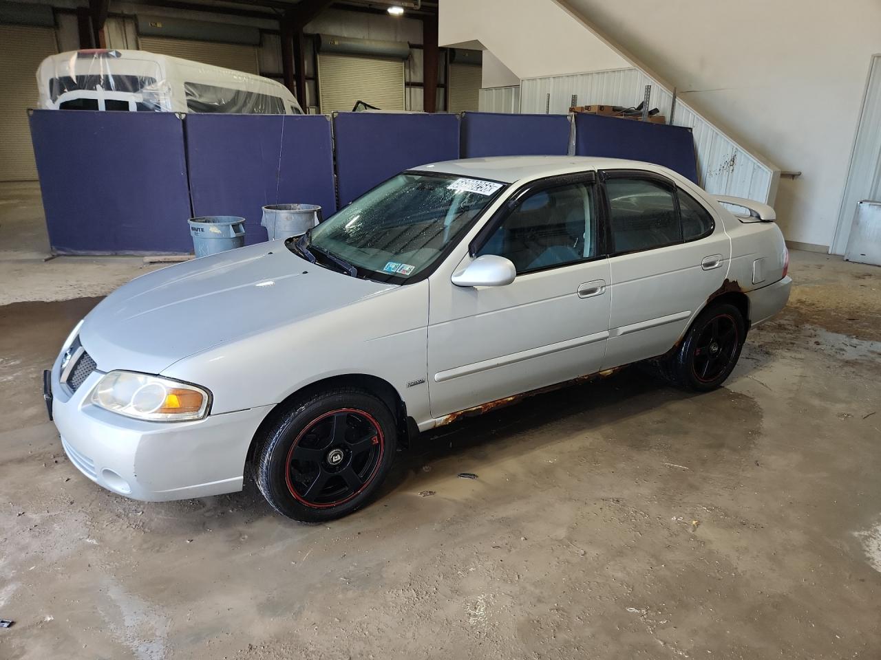 2006 Nissan Sentra 1.8 Silver vin: 3N1CB51D36L623293 Damage: Left Front Door, Corrosion, 4 To 5 Inches