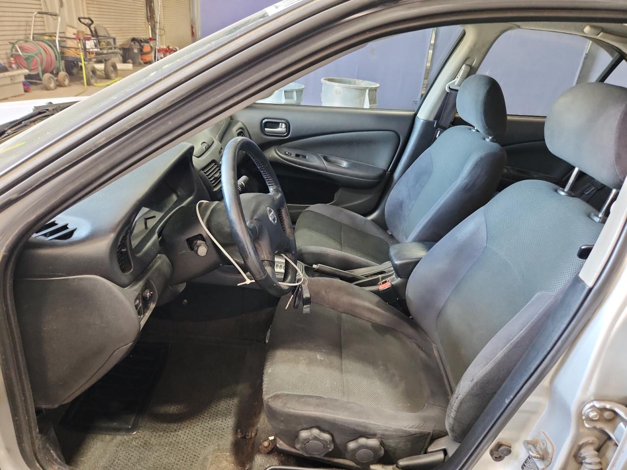 2006 Nissan Sentra 1.8 Silver vin: 3N1CB51D36L623293 Damage: Left Front Seat Cushion, Stained, Permanent