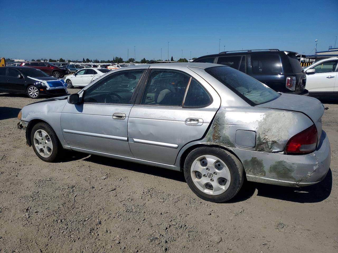 2003 Nissan Sentra Xe Серебряный vin: 3N1CB51D43L792301