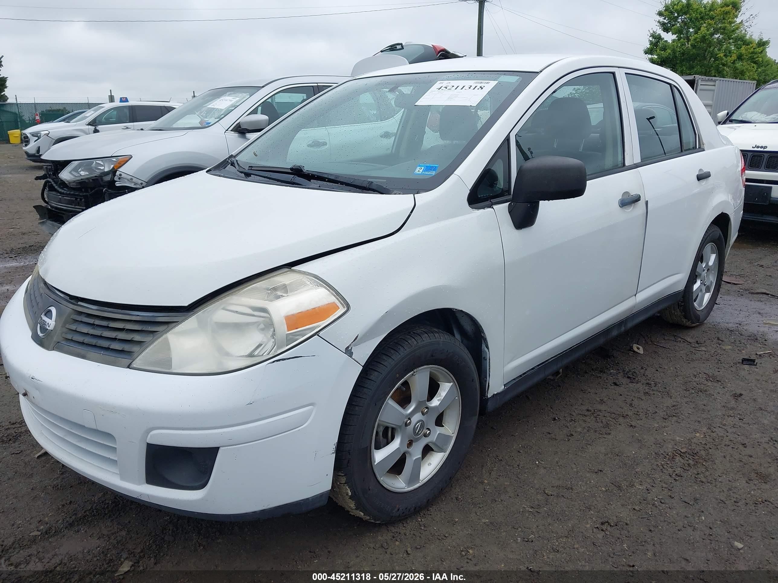 2009 Nissan Versa 1.6 Base White vin: 3N1CC11E59L458401