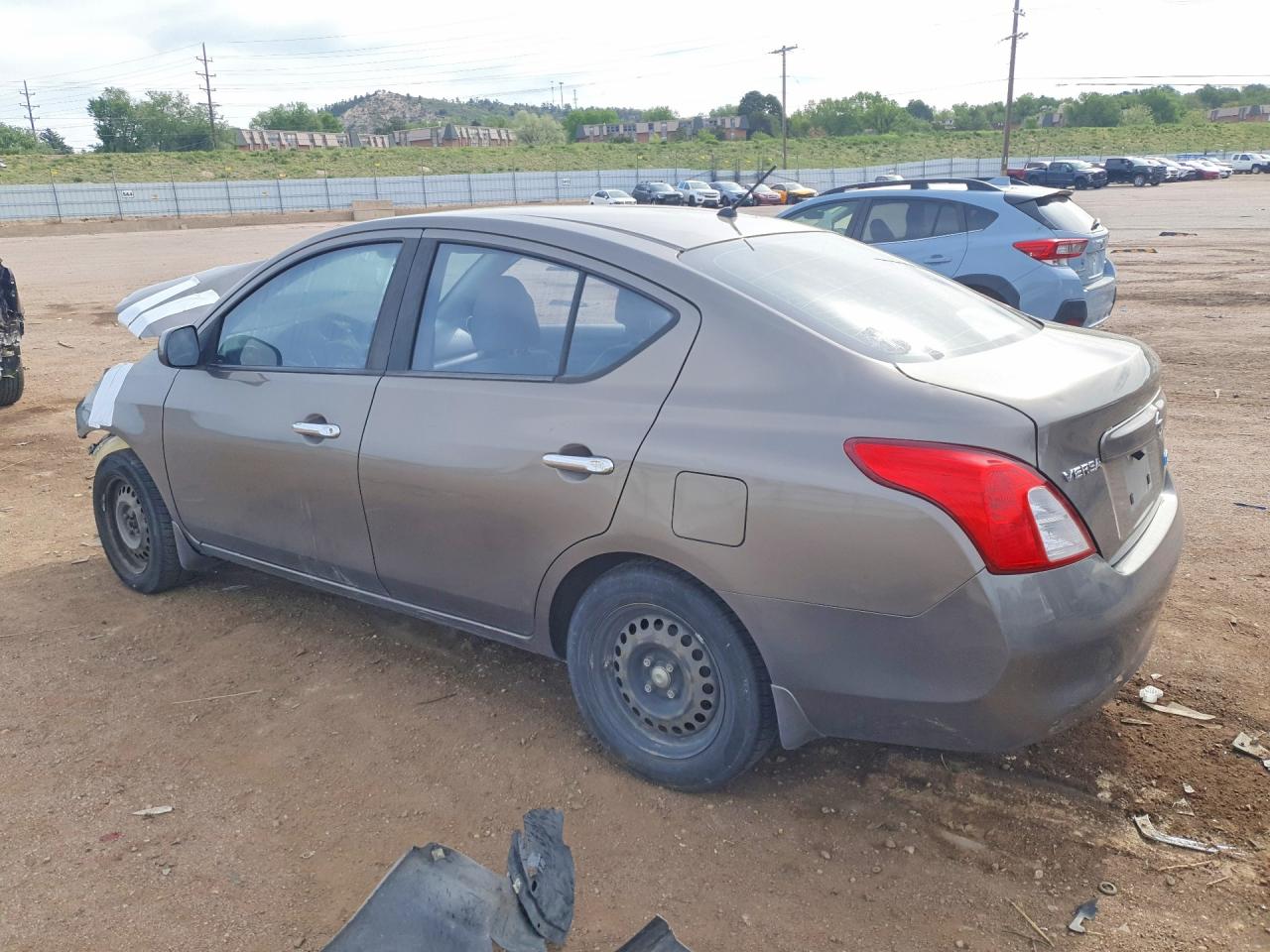 2012 Nissan Versa 1.6 S Tan vin: 3N1CN7AP2CL945738