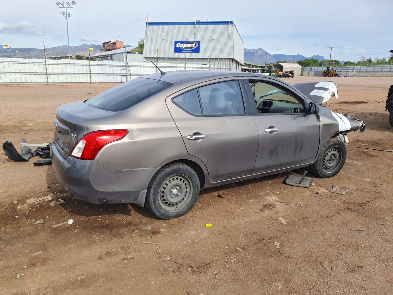 2012 Nissan Versa 1.6 S Tan vin: 3N1CN7AP2CL945738