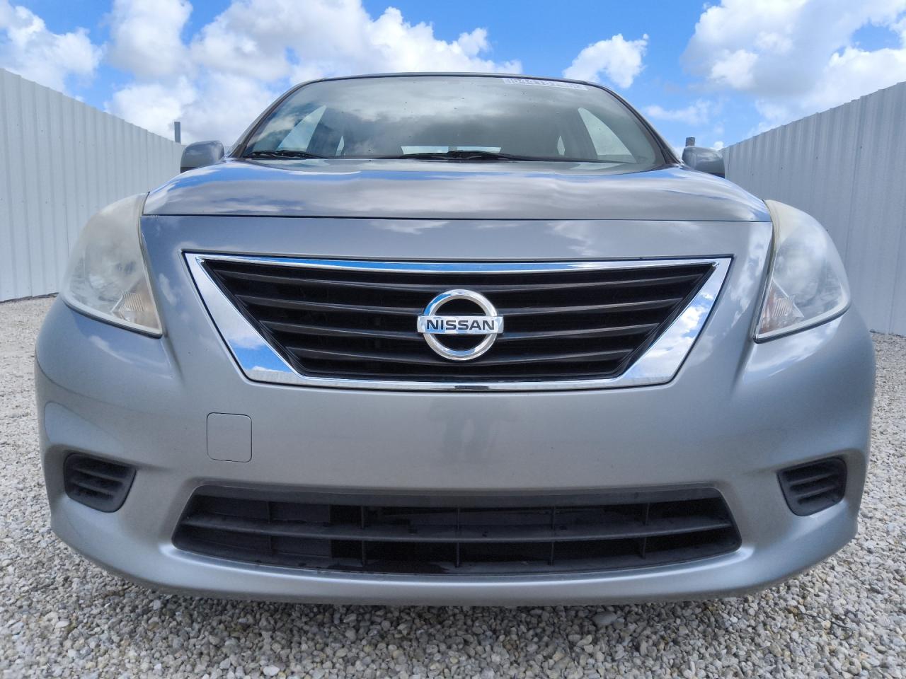 2014 Nissan Versa 1.6 S Silver vin: 3N1CN7APXEL829237 Damage: Left Head Lamp, Faded, Repair Required