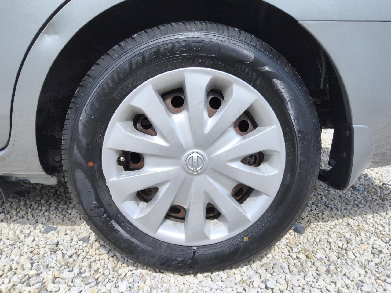 2014 Nissan Versa 1.6 S Silver vin: 3N1CN7APXEL829237 Damage: Left Rear Wheel Cover, Broken, Replacement Required