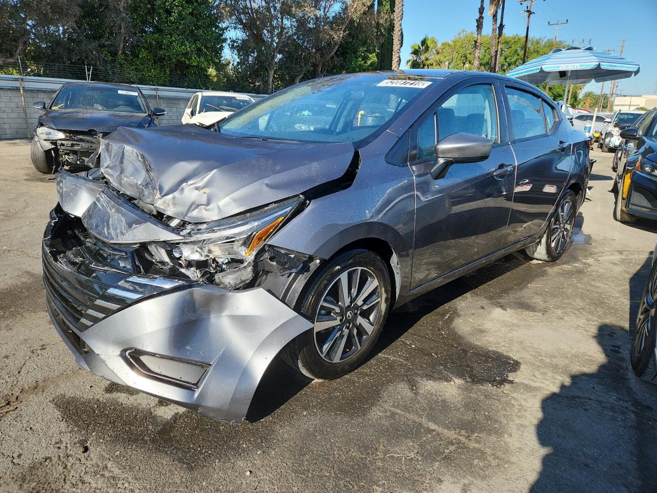 2025 Nissan Versa Sv Gray vin: 3N1CN8EV2SL826567 Damage: Left Head Lamp, Broken, Replacement Required