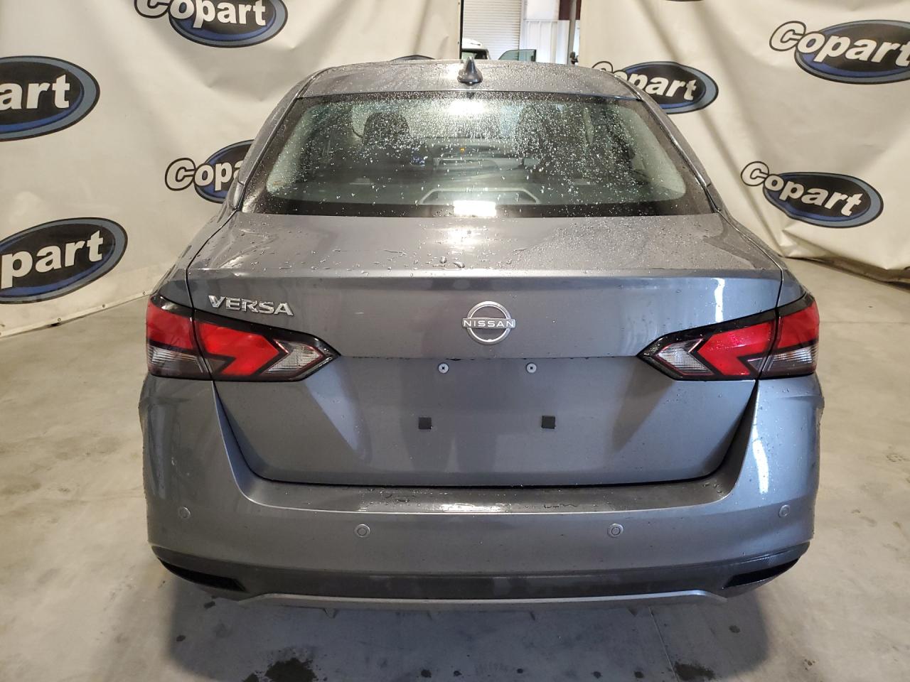 2025 Nissan Versa Gray vin: 3N1CN8EV6SL842495 Damage: Rear Bumper, Heavy Scratch, 1/8 To 1/2 Inch