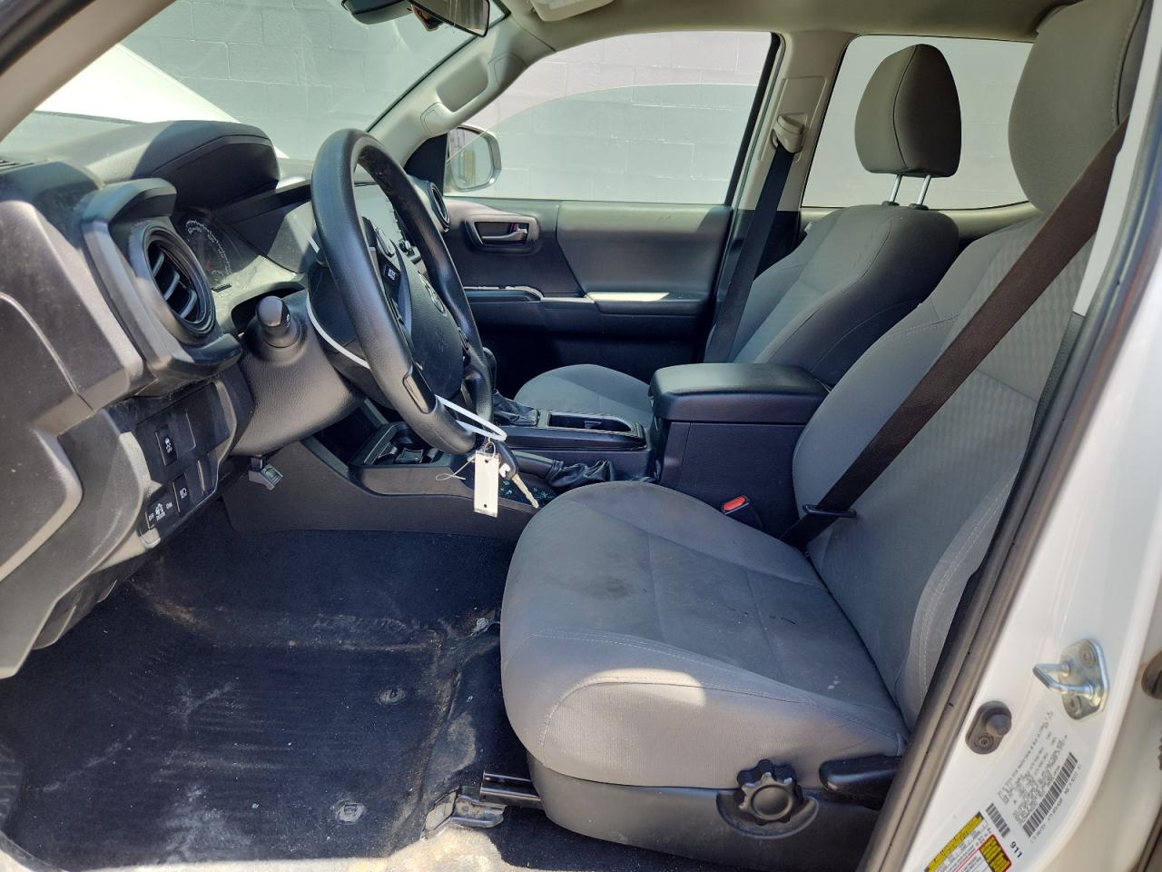 2023 Toyota Tacoma Sr V6 White vin: 3TMCZ5AN4PM652363 Damage: Left Front Seat Cushion, Stained, Permanent