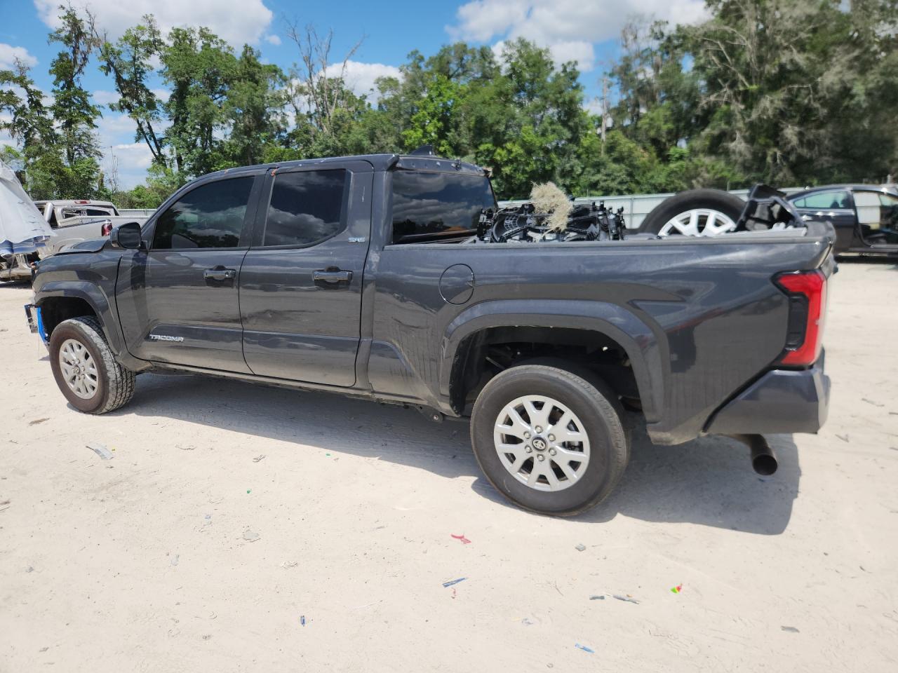 2024 Toyota Tacoma Sr5 Gray vin: 3TMKB5FN4RM023973 Damage: Left Rear Door, Dent(S) W/No Paint Dmg, 1/2 To 1 Inch