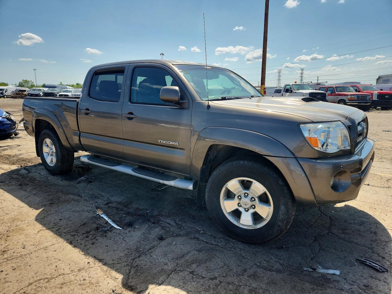 2010 Toyota Tacoma Double Cab Prerunner Long Bed Tan vin: 3TMKU4HN6AM025827