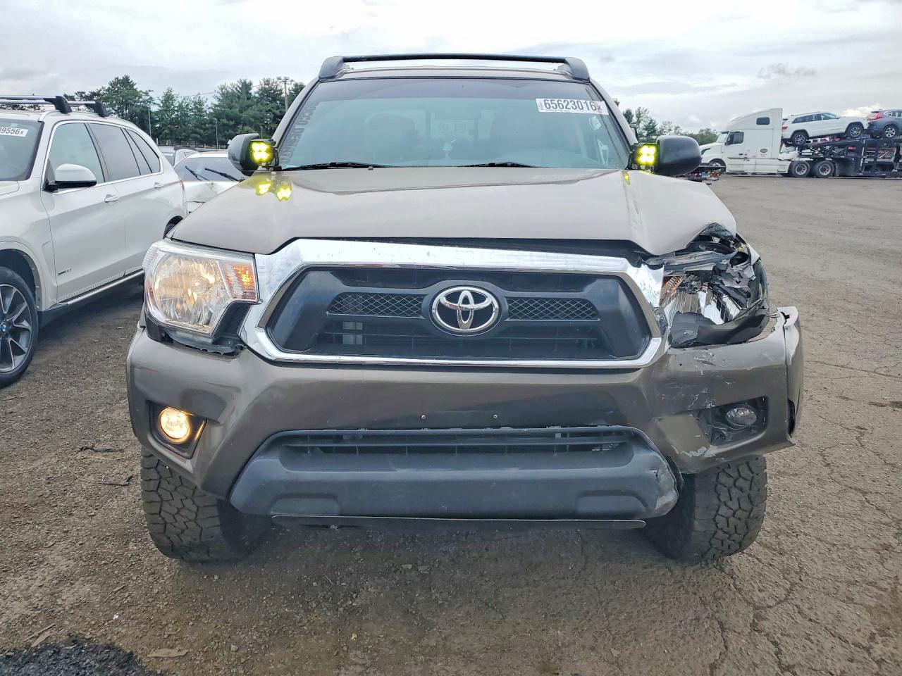 2015 Toyota Tacoma V6 Tan vin: 3TMLU4EN8FM200238