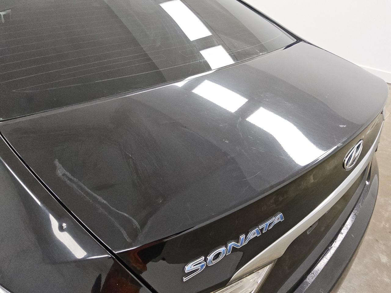 2015 Hyundai Sonata Hybrid Base Black vin: KMHEC4A48FA134792 Damage: Deck Lid, Heavy Scratch, 2 To 3 Inches