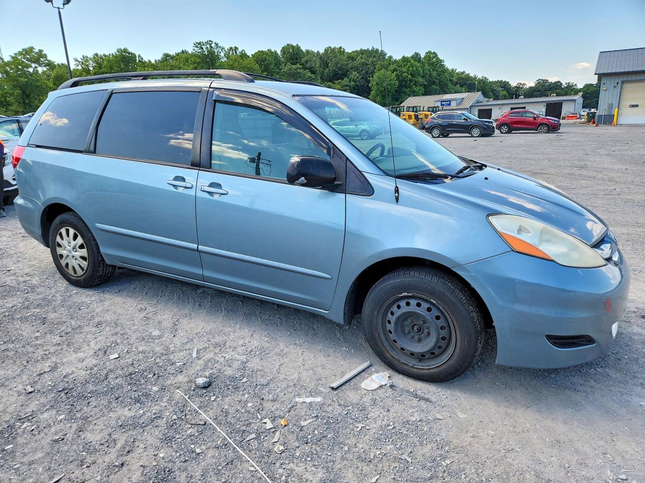 2009 Toyota Sienna Le 7-passenger Blue vin: 5TDZK23C69S245883