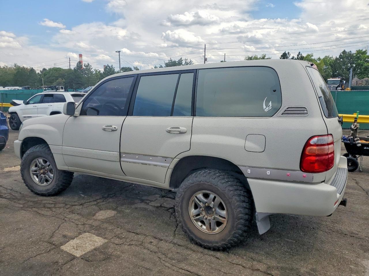 2000 Toyota Land Cruiser Base Beige vin: JT3HT05J2Y0096774