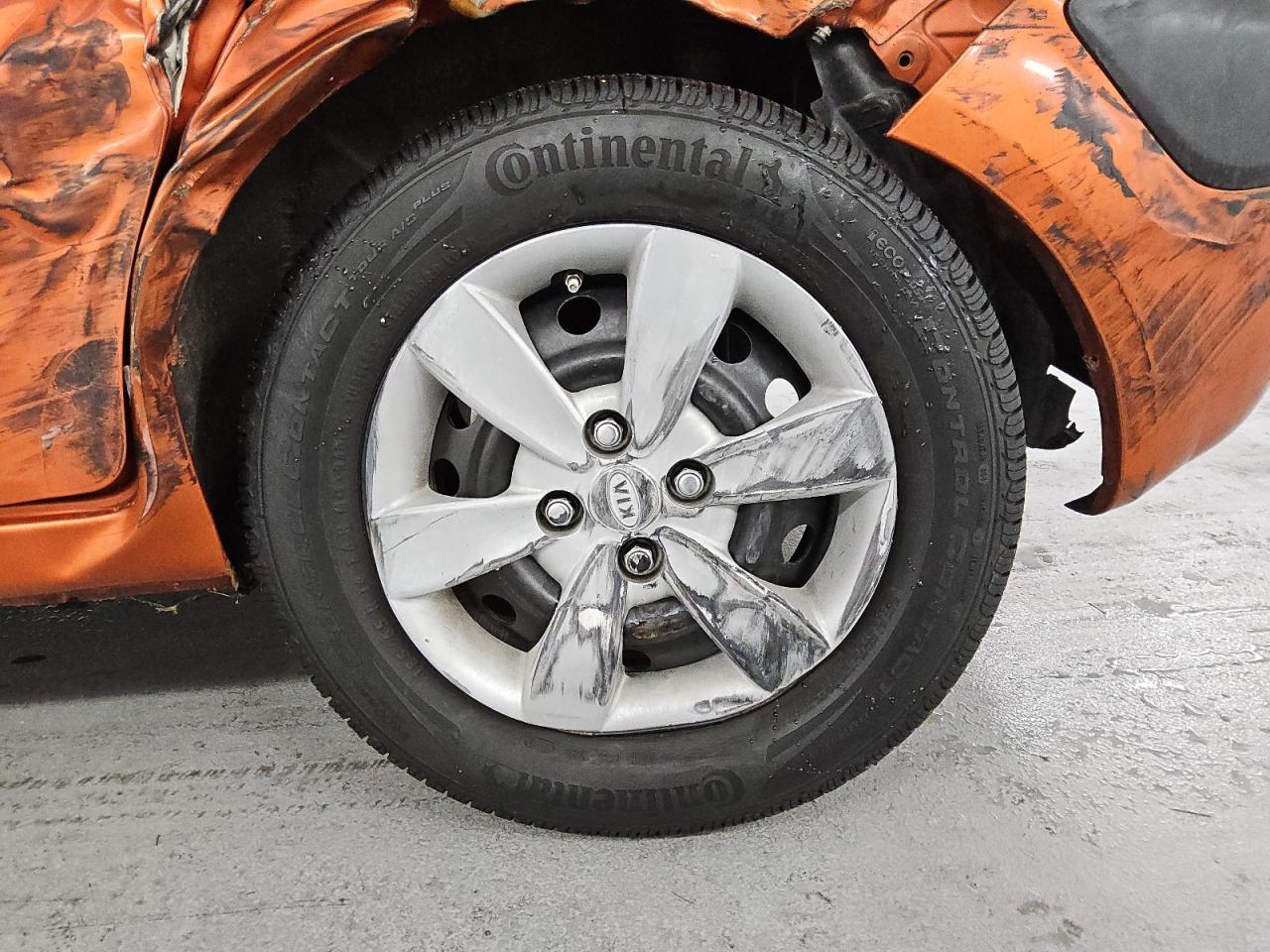 2009 Kia Rio5 Lx Orange vin: KNADE243896567101 Damage: Left Rear Wheel Cover, Curb Rash, > 12 Inches