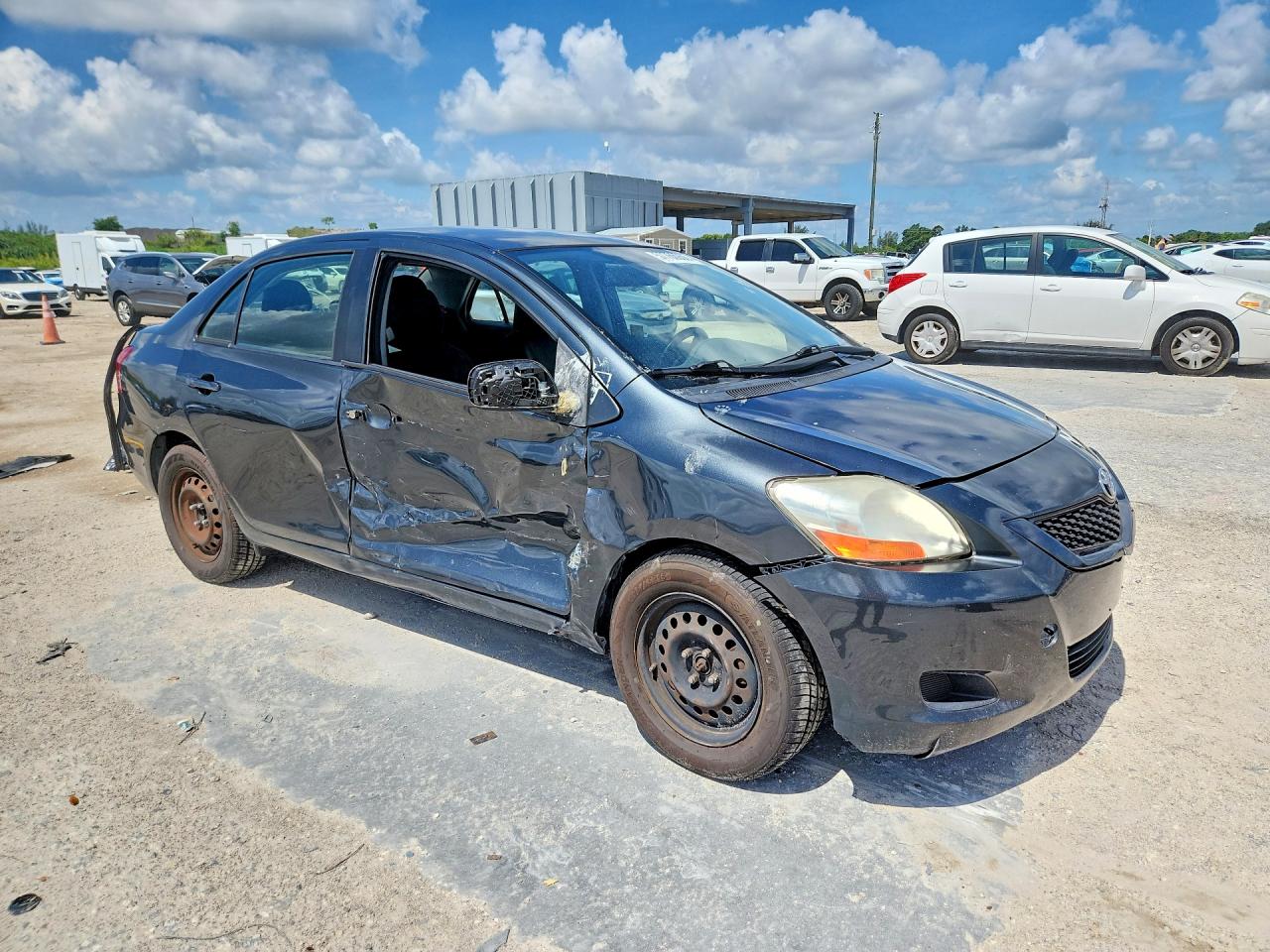 2011 Toyota Yaris Base Black vin: JTDBT4K34BL002107