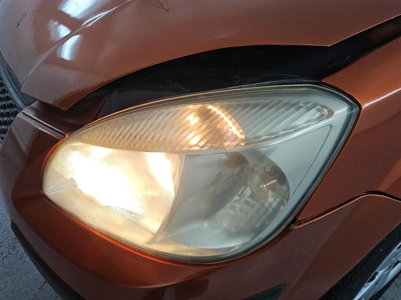 2009 Kia Rio5 Lx Orange vin: KNADE243896567101 Damage: Left Head Lamp, Faded, Repair Required
