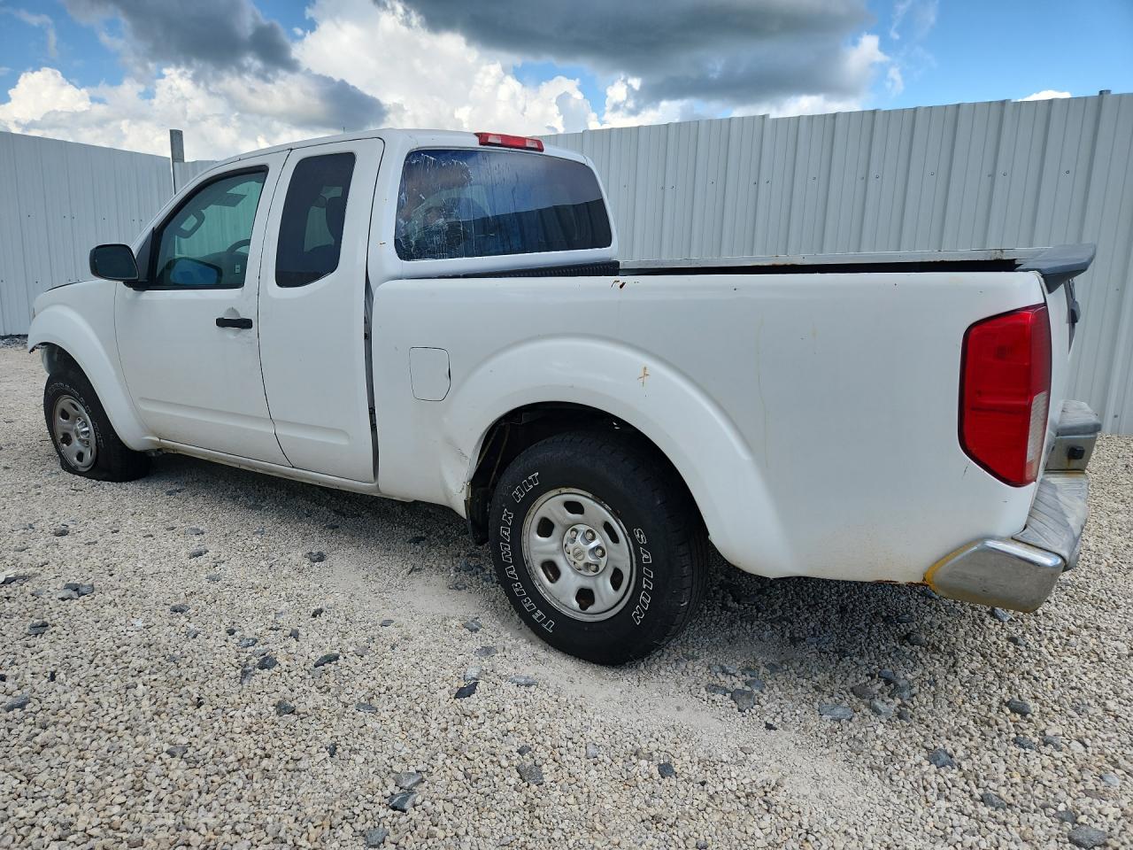 2015 Nissan Frontier S White vin: 1N6BD0CT8FN735479 Damage: Left Front Tire, Flat, Repair Required