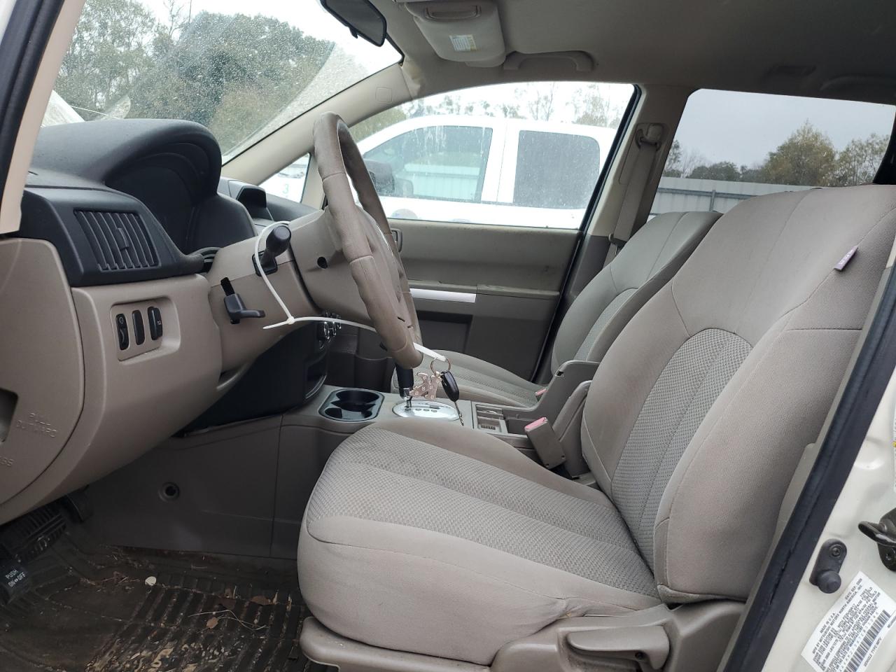 2007 Mitsubishi Endeavor Ls White vin: 4A4MM21S87E033206 Damage: Left Front Headrest, Missing, Replacement Required
