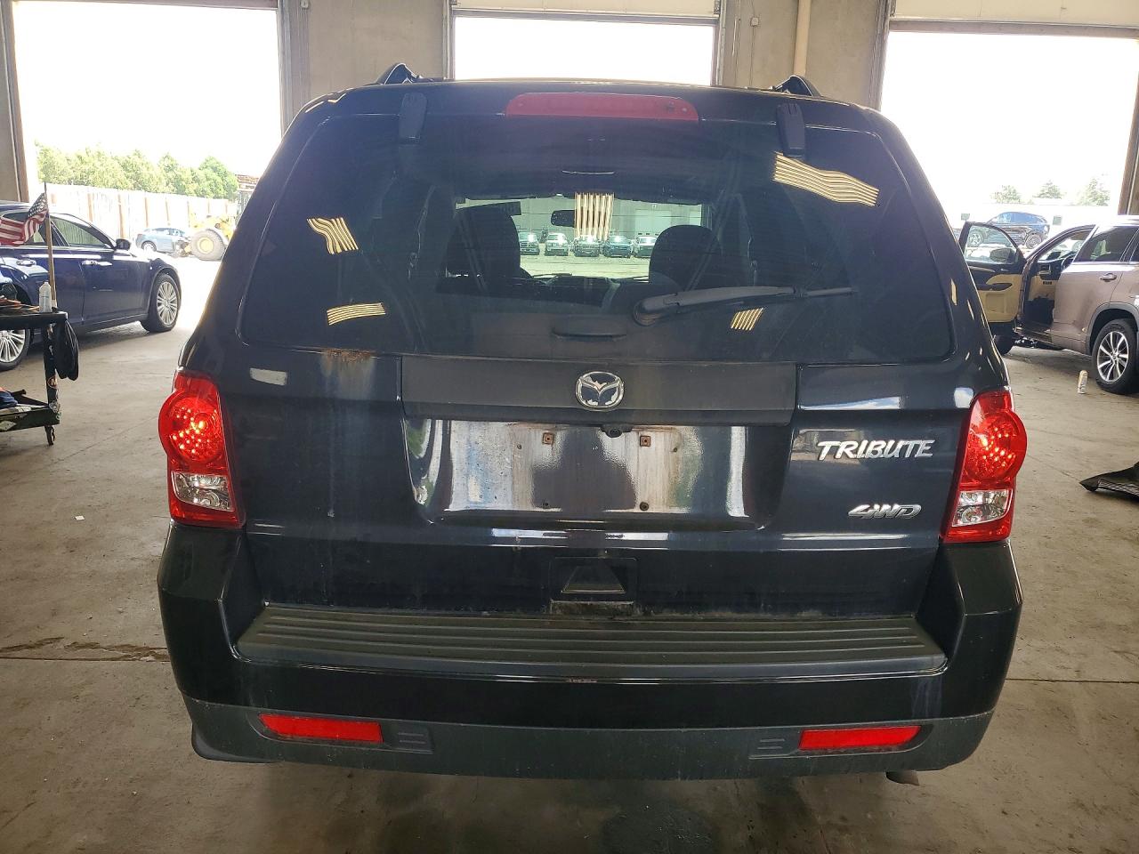 2011 Mazda Tribute I Черный vin: 4F2CY9C74BKM06888