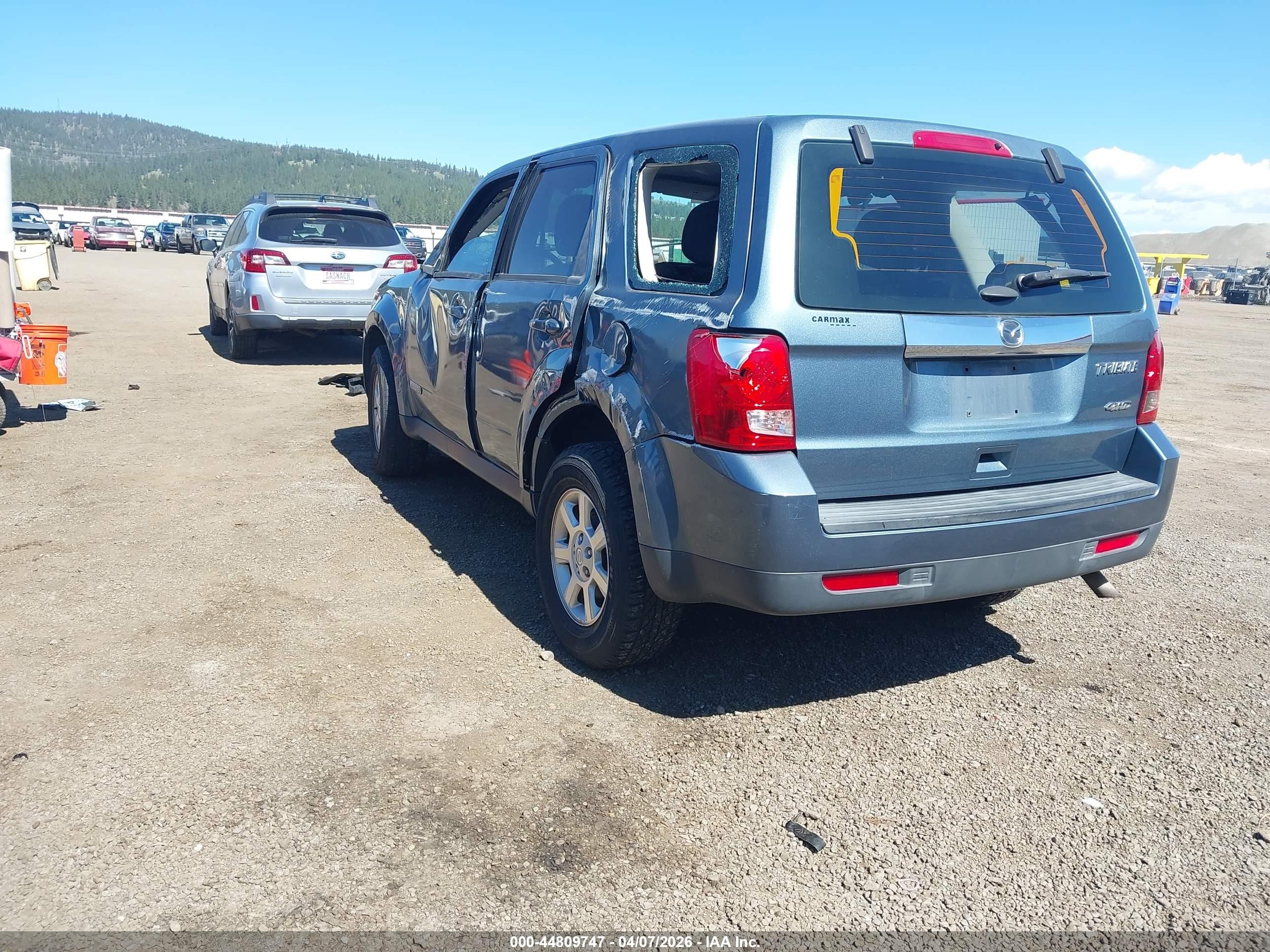 2011 Mazda Tribute   Blue vin: 4F2CY9C74BKM07457