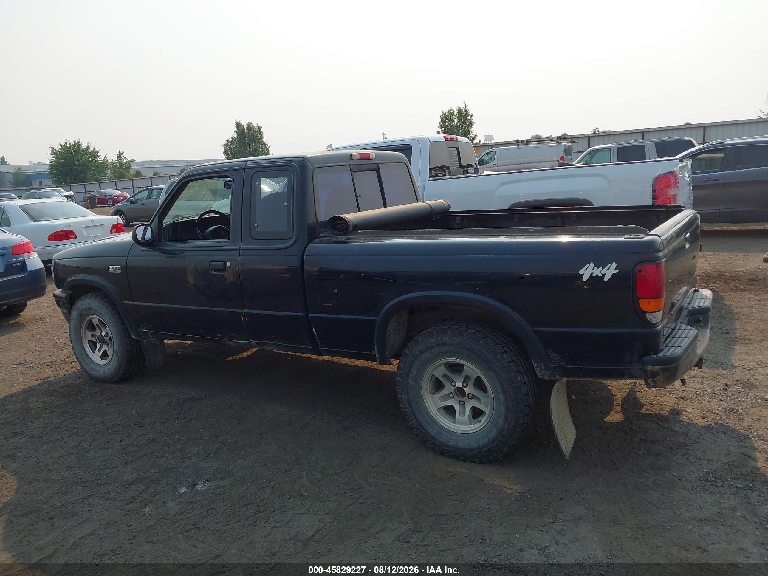 1994 Mazda B4000 Cab Plus Black vin: 4F4DR17X0RTM60620