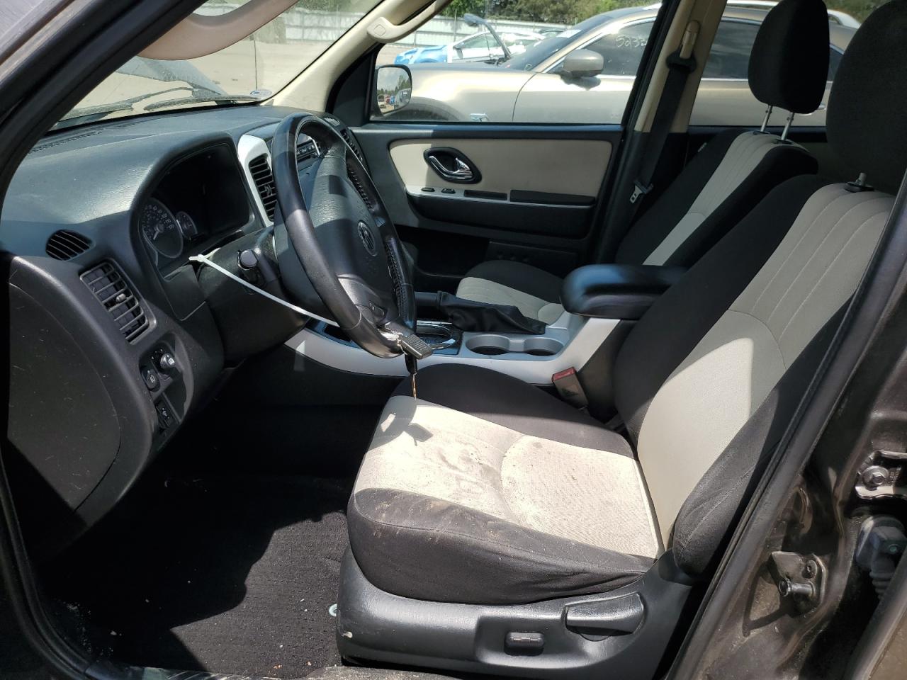 2007 Mercury Mariner Luxury Gray vin: 4M2CU81177KJ04100 Damage: Left Front Seat Cushion, Stained, Permanent