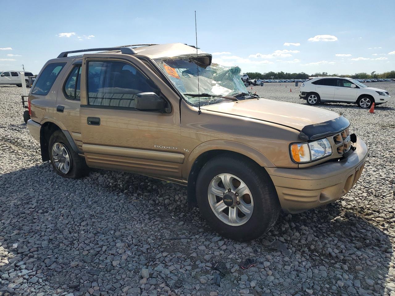 2001 Isuzu Rodeo S Tan vin: 4S2CK58W714306169
