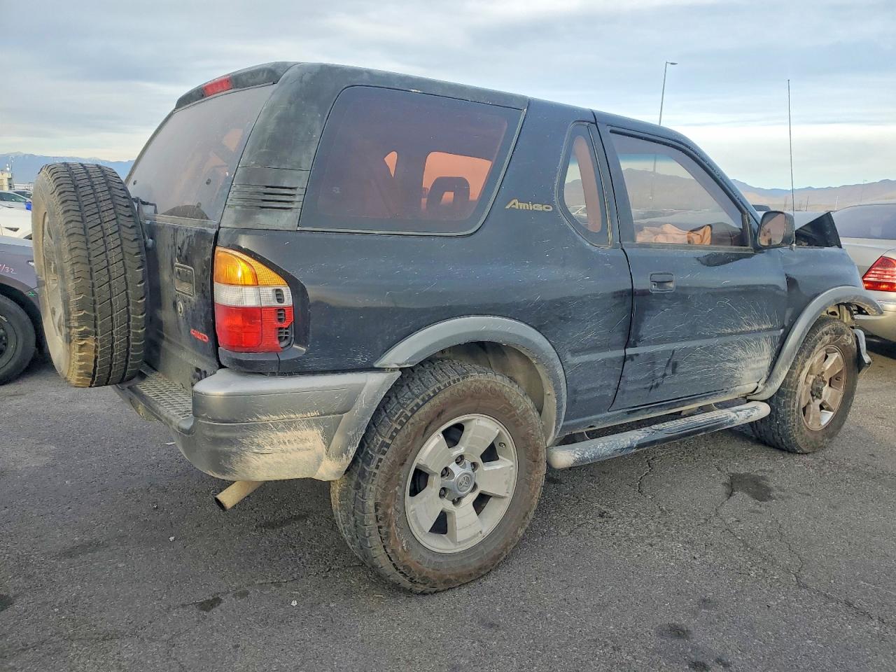 1999 Isuzu Amigo Black vin: 4S2CM57W5X4330538