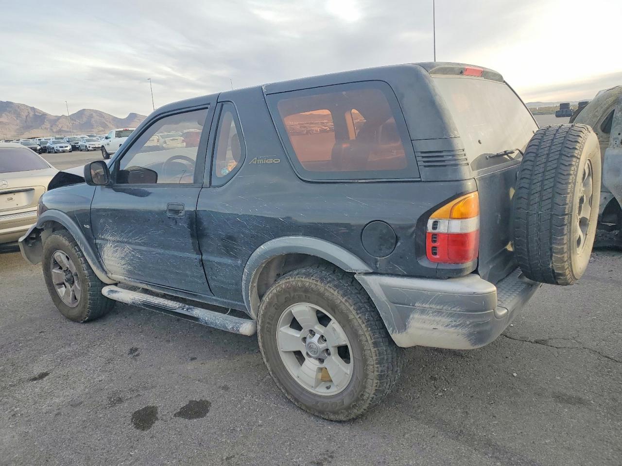 1999 Isuzu Amigo Black vin: 4S2CM57W5X4330538