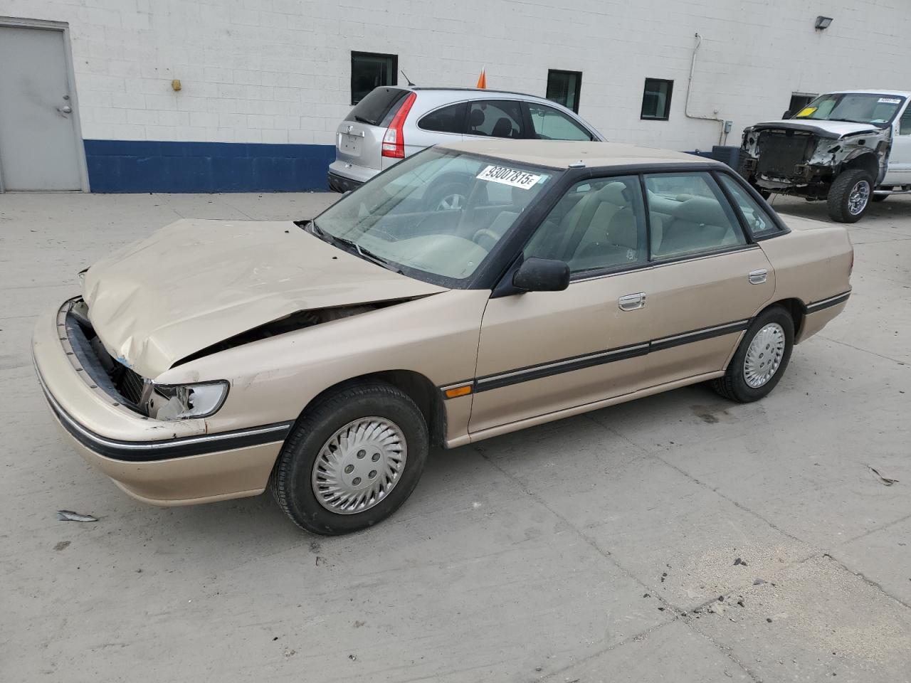 1993 Subaru Legacy L Tan vin: 4S3BC6334P7654879