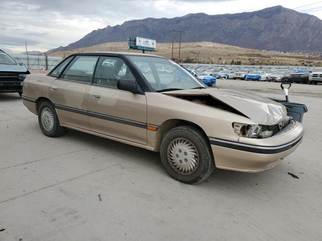1993 Subaru Legacy L Tan vin: 4S3BC6334P7654879
