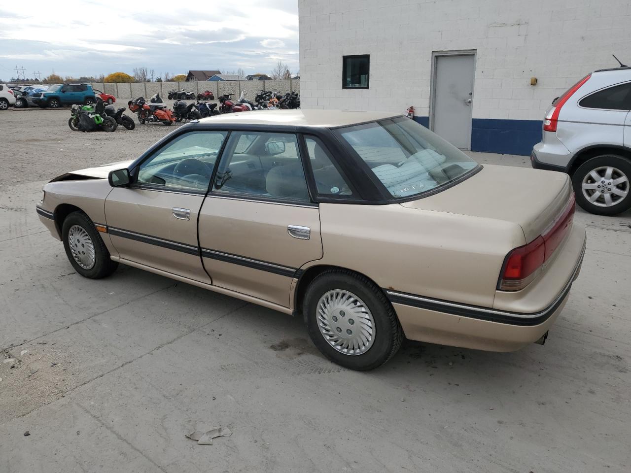 1993 Subaru Legacy L Tan vin: 4S3BC6334P7654879