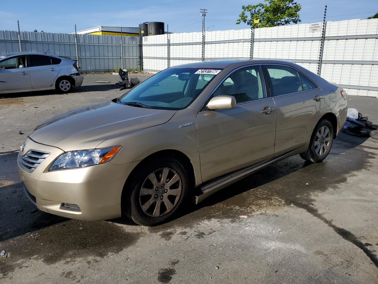 2009 Toyota Camry Hybrid Gold vin: 4T1BB46KX9U078306 Damage: Left Rocker Panel Molding, Broken, Replacement Required