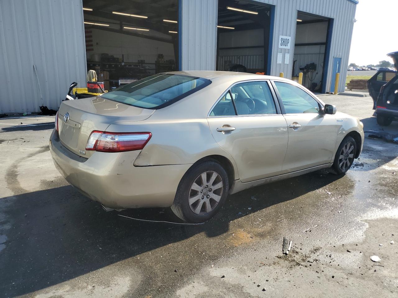 2009 Toyota Camry Hybrid Gold vin: 4T1BB46KX9U078306 Damage: Rear Bumper/Cover, Broken, Replacement Required