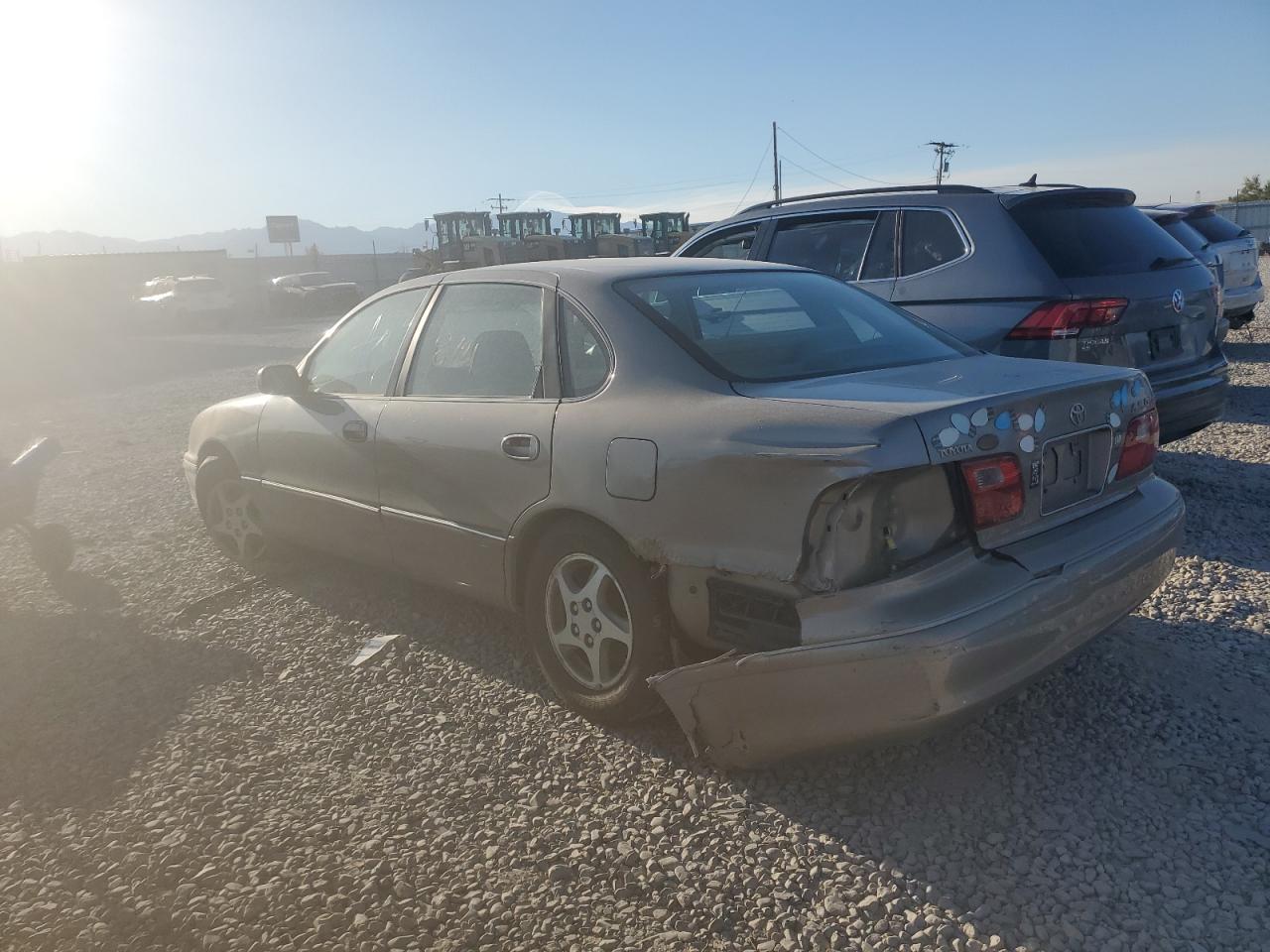 1999 Toyota Avalon Xl Tan vin: 4T1BF18B5XU329343