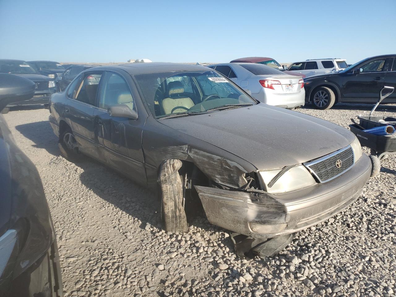 1999 Toyota Avalon Xl Tan vin: 4T1BF18B5XU329343