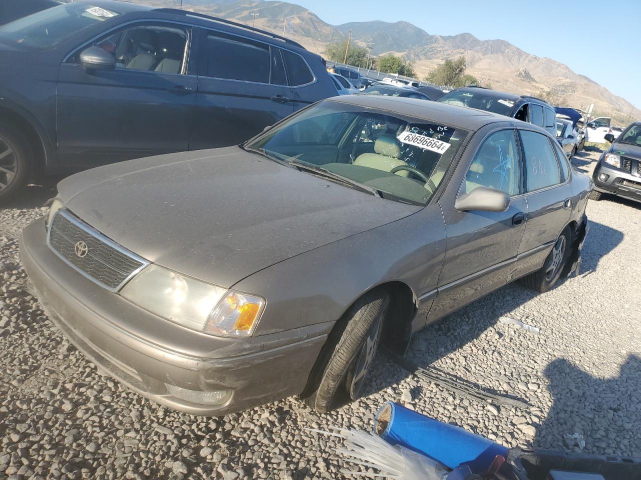 1999 Toyota Avalon Xl Tan vin: 4T1BF18B5XU329343