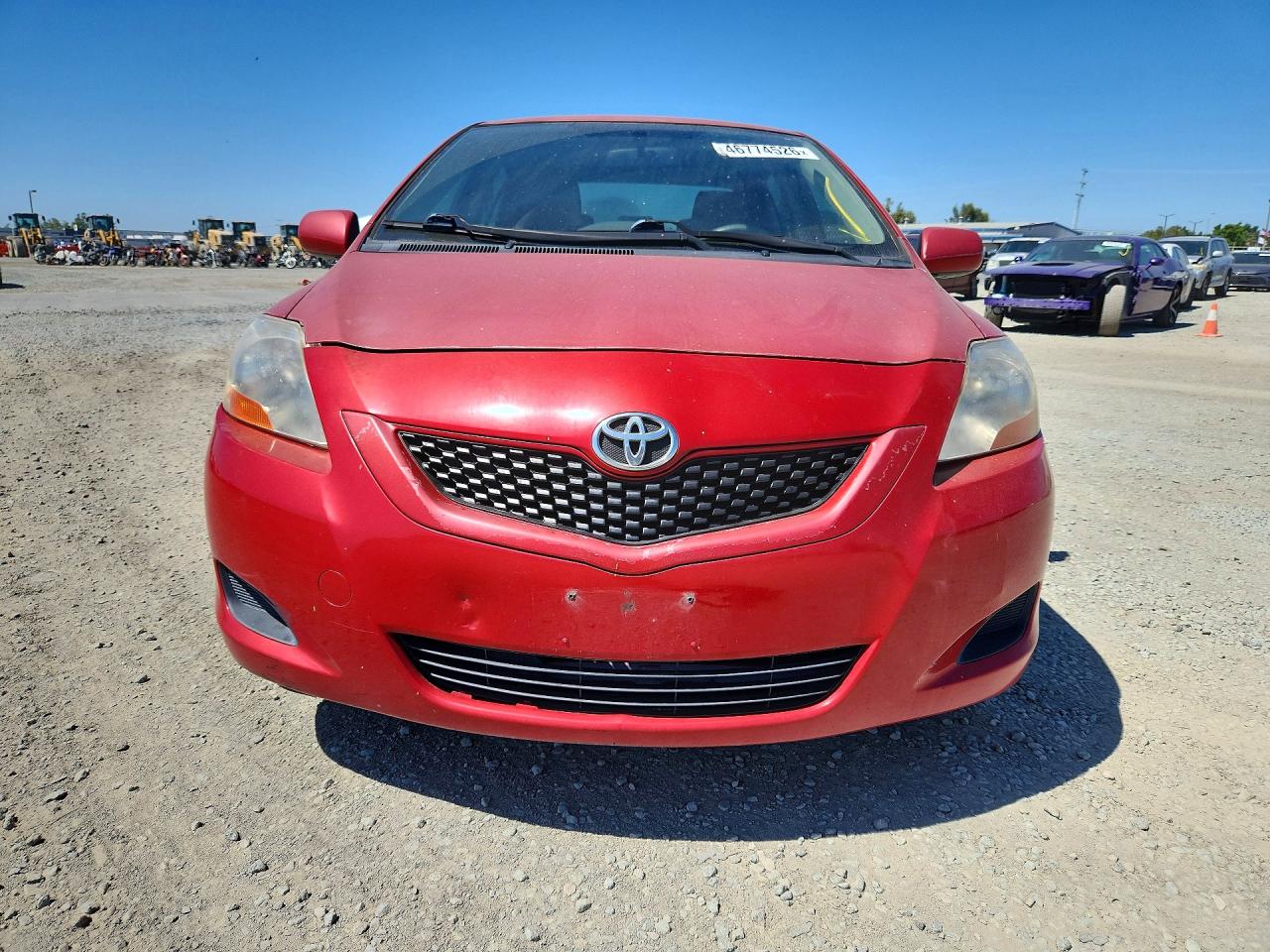 2009 Toyota Yaris Base Red vin: JTDBT903694046372