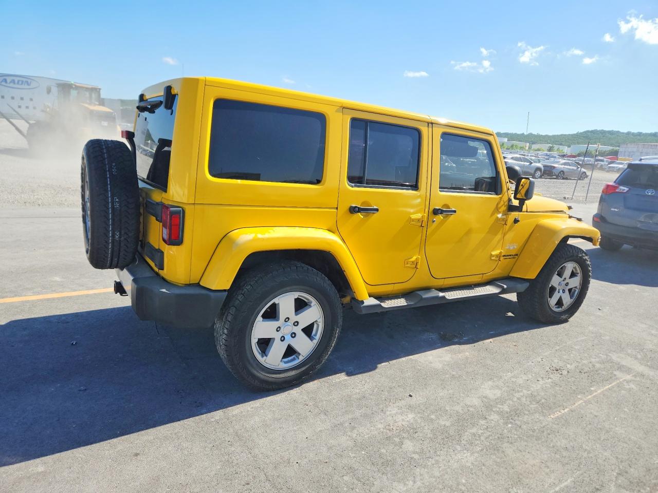 2011 Jeep Wrangler Unlimited Sahara Yellow vin: 1J4HA5H12BL530282