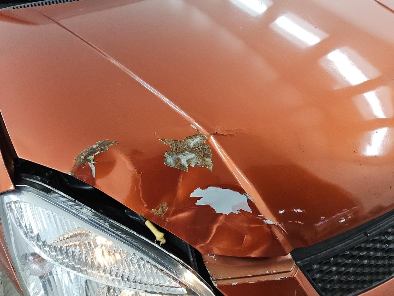 2009 Kia Rio5 Lx Orange vin: KNADE243896567101 Damage: Hood, Rust, 6 To 7 Inches