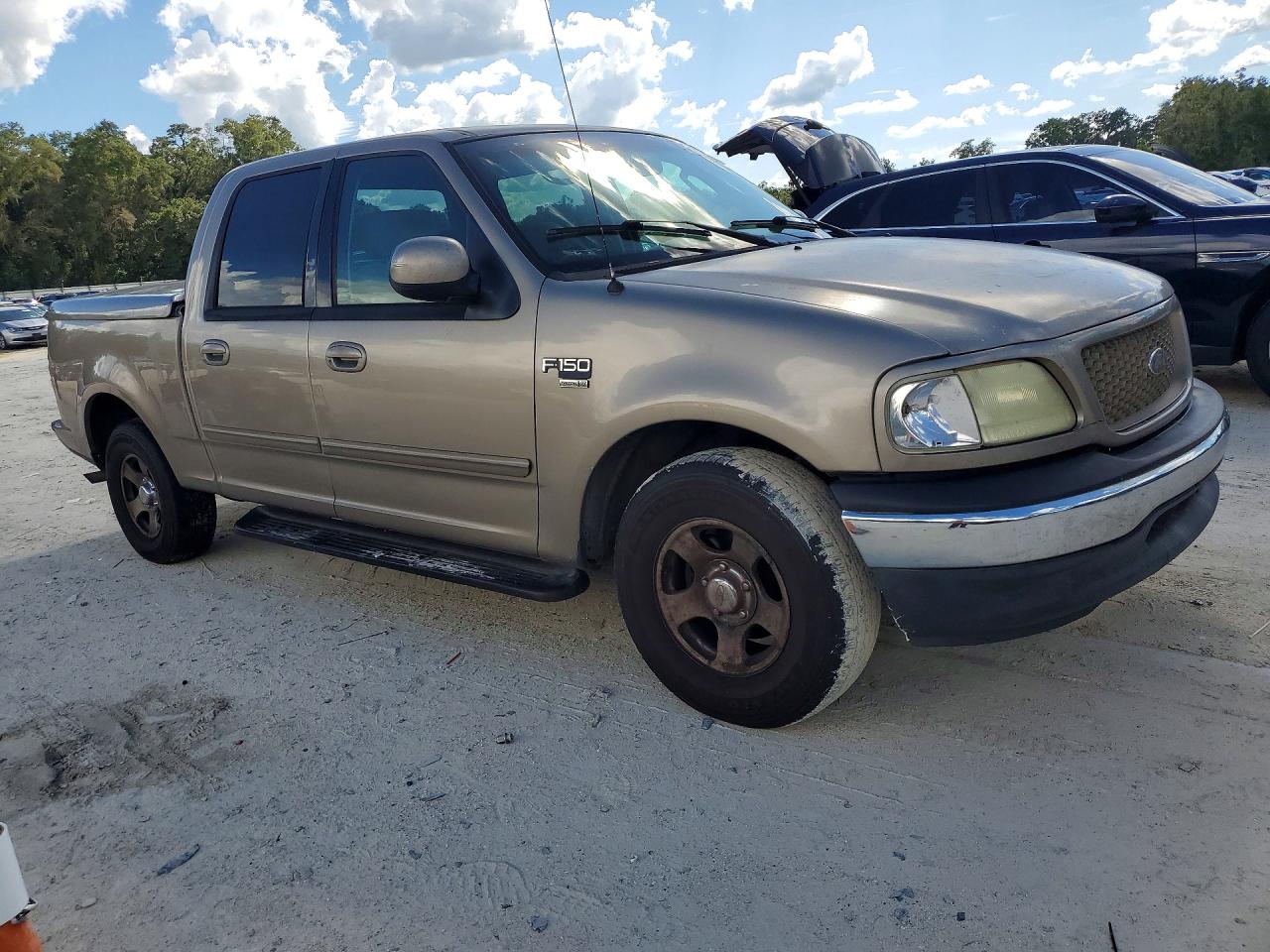 2002 Ford F150 Supercrew Tan vin: 1FTRW076X2KE17987