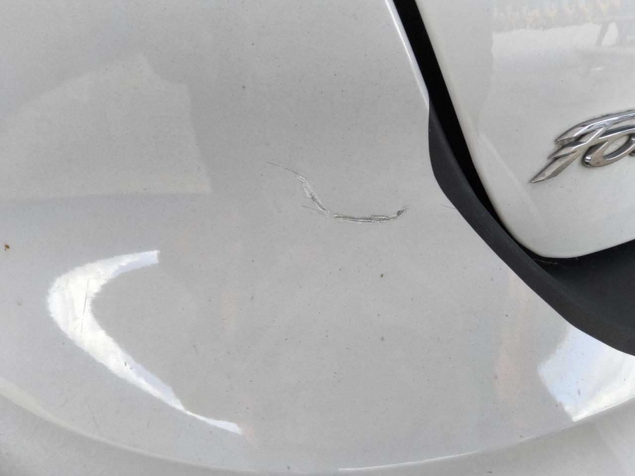 2014 Ford Focus Se White vin: 1FADP3F22EL345890 Damage: Rear Bumper, Heavy Scratch, 1 To 2 Inches