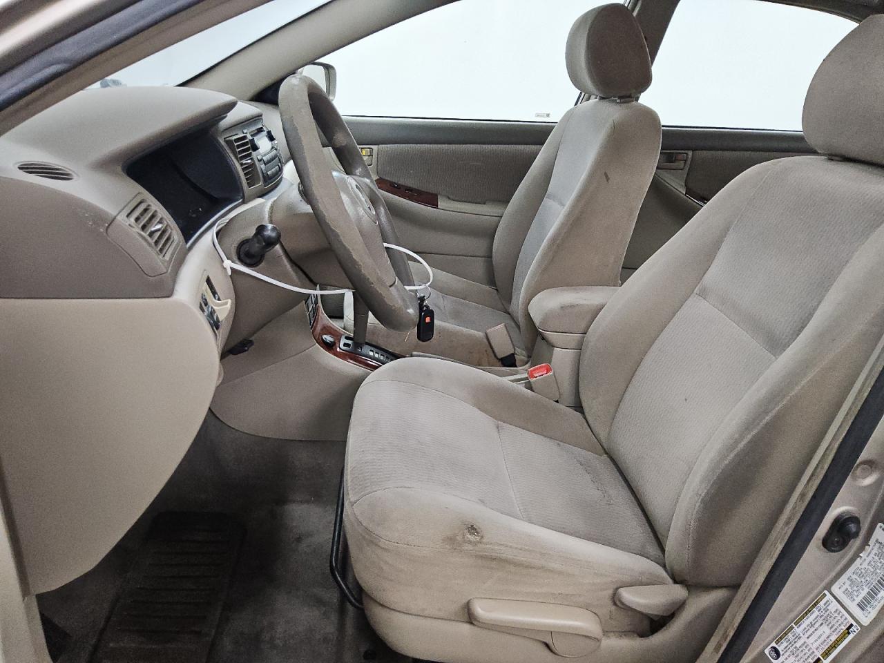 2005 Toyota Corolla Le Beige vin: 1NXBR32E35Z411090 Damage: Steering Wheel, Worn, Replacement Required