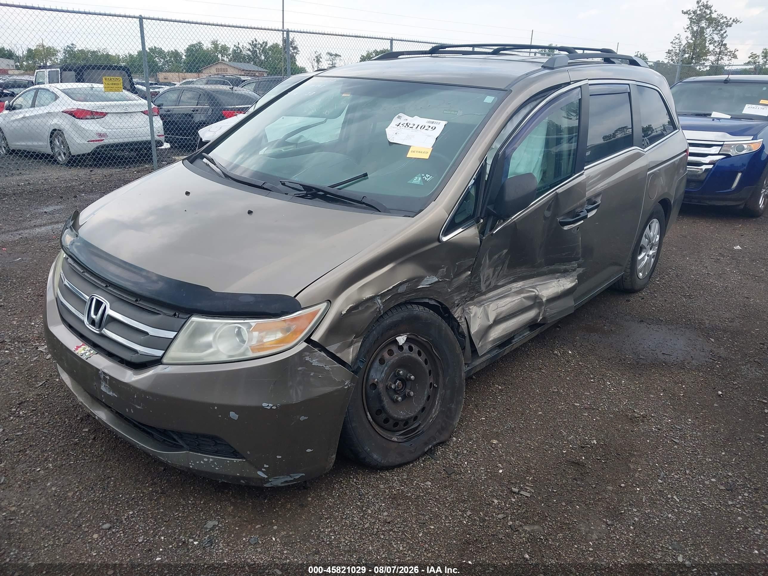 2012 Honda Odyssey Lx Tan vin: 5FNRL5H23CB061205