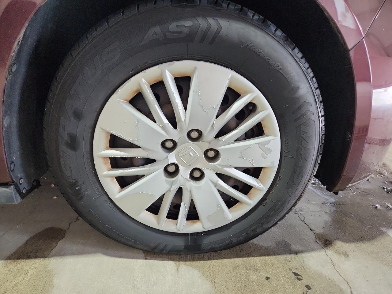 2014 Honda Odyssey Lx Maroon vin: 5FNRL5H2XEB059843 Damage: Right Front Wheel Cover, Peeling, > 12 Inches