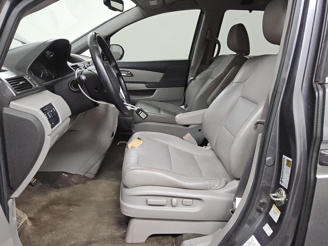 2014 Honda Odyssey Touring Blue vin: 5FNRL5H96EB070772 Damage: Left Front Seat Cushion, Torn, 7 To 8 Inches