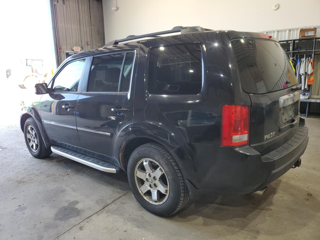 2011 Honda Pilot Touring Black vin: 5FNYF4H98BB028192 Damage: Left Rocker Panel, Rust, > 12 Inches